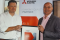 Mark Garstang (right) receives Coolair’s new partnership certification from Deane Flint, Mitsubishi Electric's sales and marketing director. 