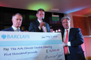Left to right: England football legend Sir Geoff Hurst and Barry Lea, Chairman of Advanced Engineering, donating £5,000 to Ark Cancer Centre Charity Trustee Merv Rees.
